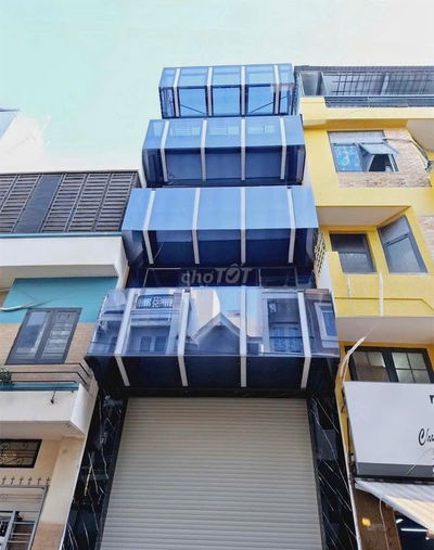 NHÀ ĐẸP ỐP KÍNH - 124A Nguyễn Hồng Đào P14 Q.TB -5x18 5 tầng 400m sàn