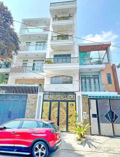 Nhà 1 Trệt 4 Lầu 7PN Có Thang Máy Mặt Tiền Đường Số Phường Tân Quy