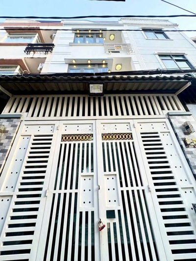 NHÀ 2 LẦU XE HƠI ĐẬU CỬA SÁT MT HUỲNH TẤN PHÁT