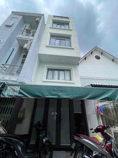 Nhà 4 tầng kiên cố hẻm xe hơi Quận 7 - 7 phòng ngủ - dòng tiền 20tr